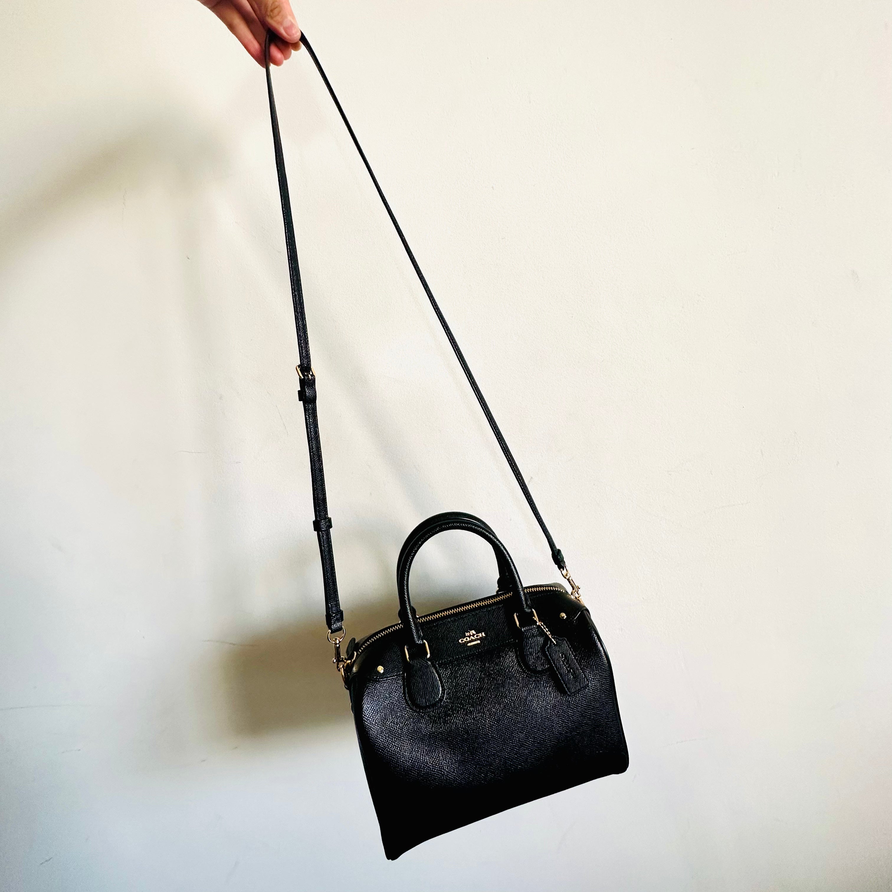 Coach black leather online sling bag