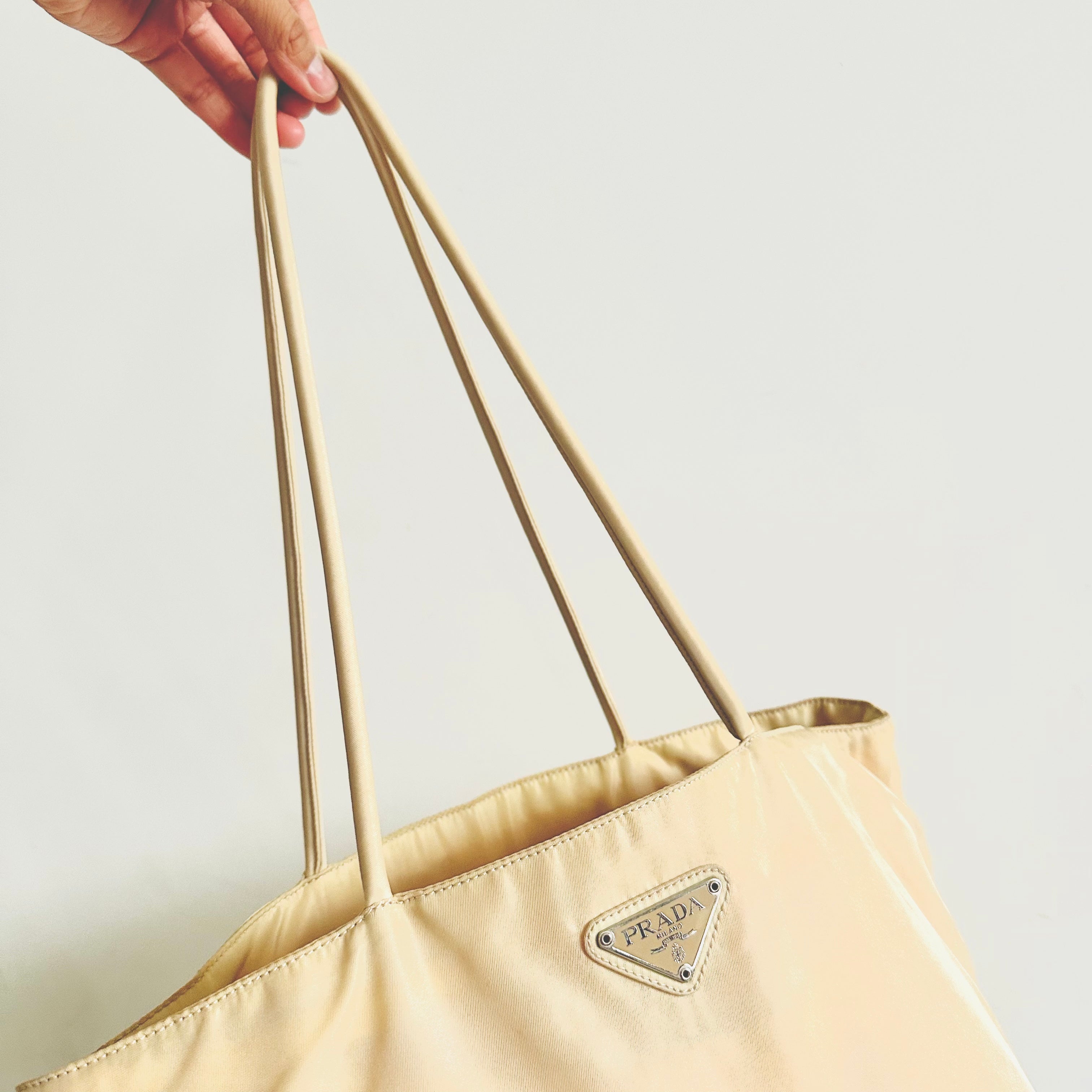 Prada cream online bag