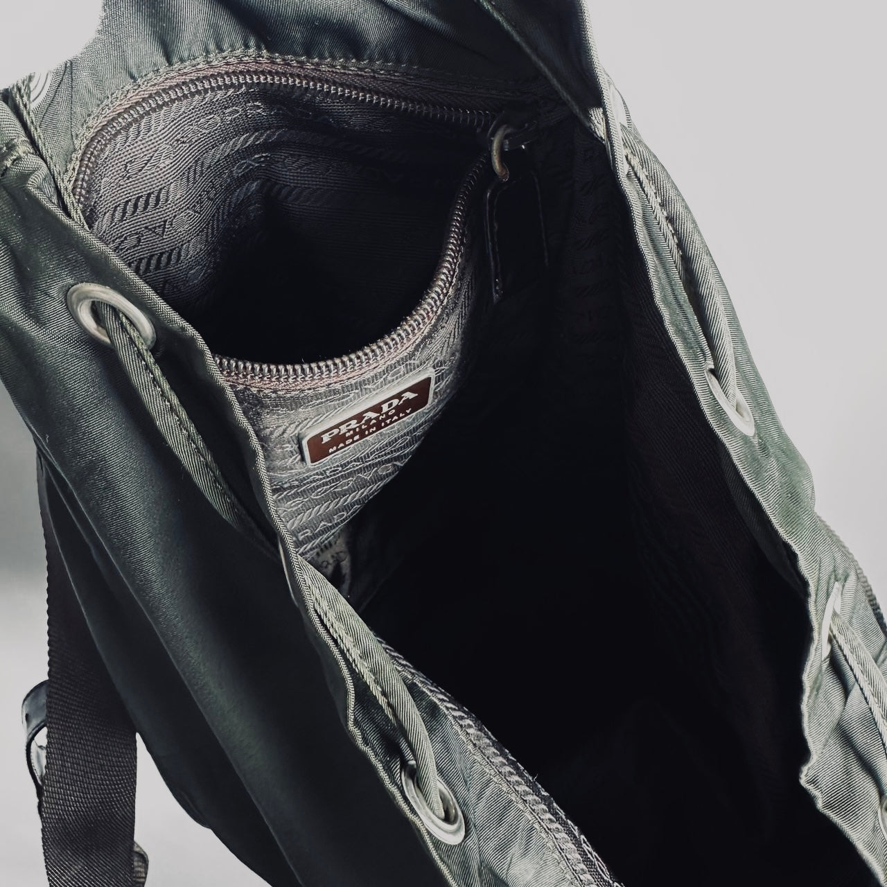 Prada Ebano Khaki Monogram Logo Vela Classic Nylon & Leather Drawstring Backpack Bag