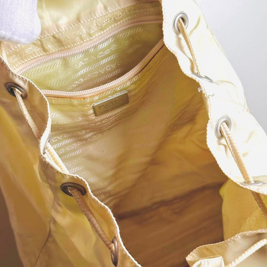 Prada Off White Tessuto Monogram Logo Nylon & Leather Backpack Flap Drawstring Bag