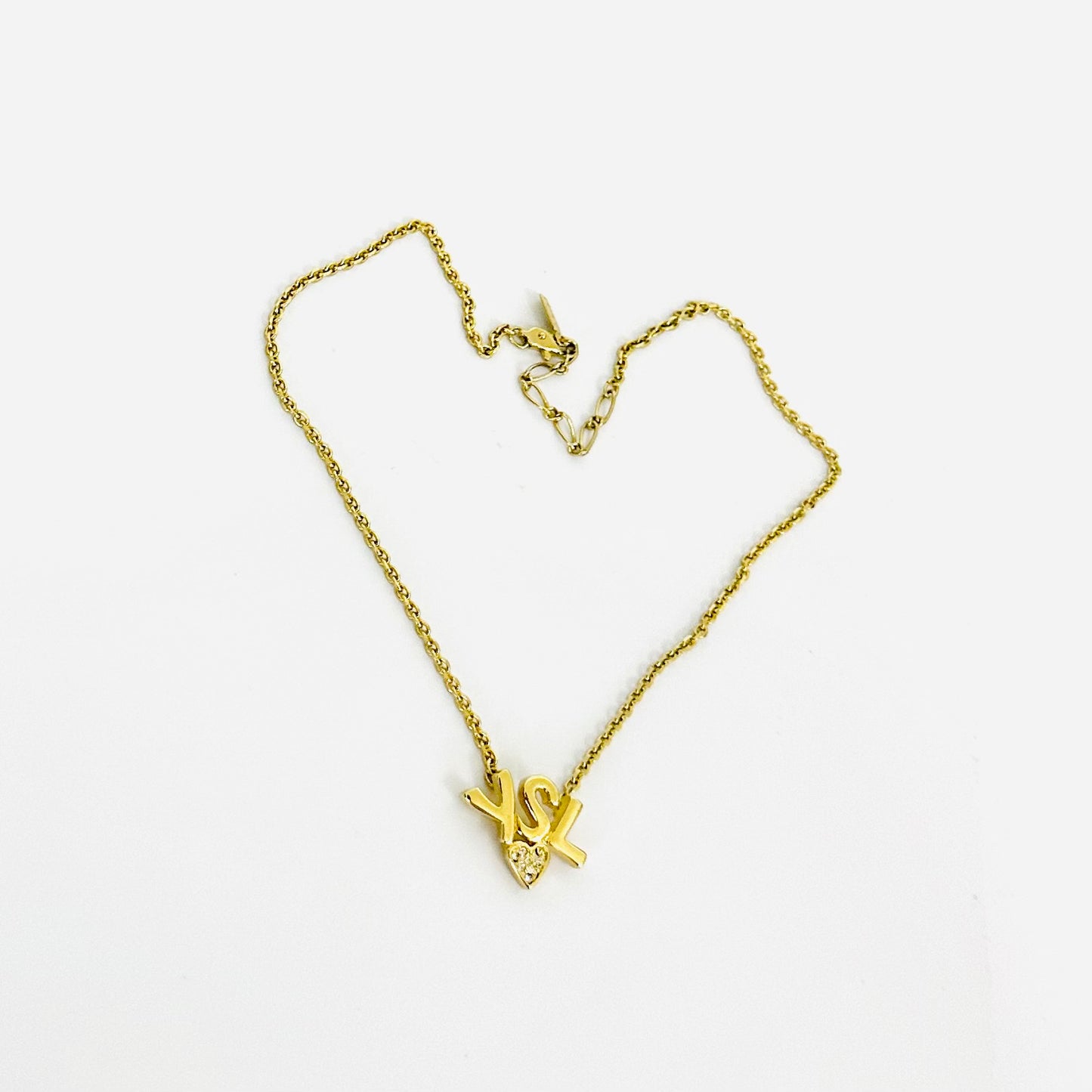 YSL Yves Saint Laurent Gold Monogram Logo & Crystal Heart Pendant Necklace